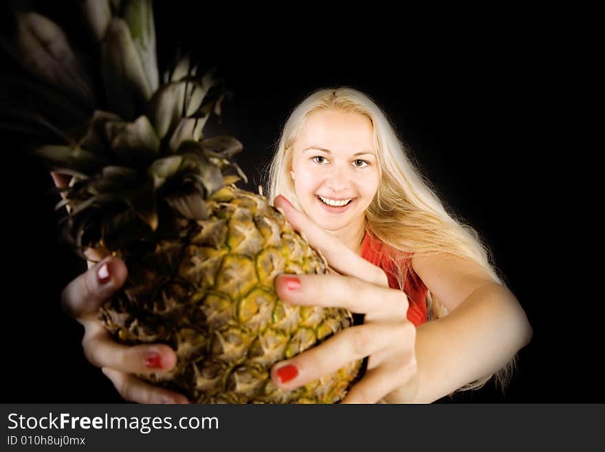 Smiling healthy female with pineapple in hands. Smiling healthy female with pineapple in hands