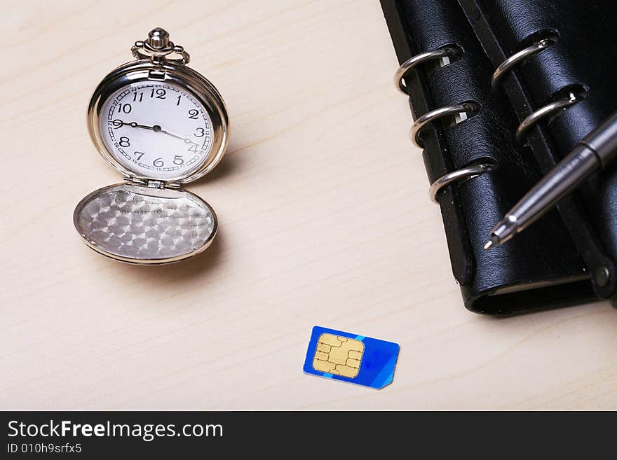 Pocket watch with notebook and SIM card. Pocket watch with notebook and SIM card