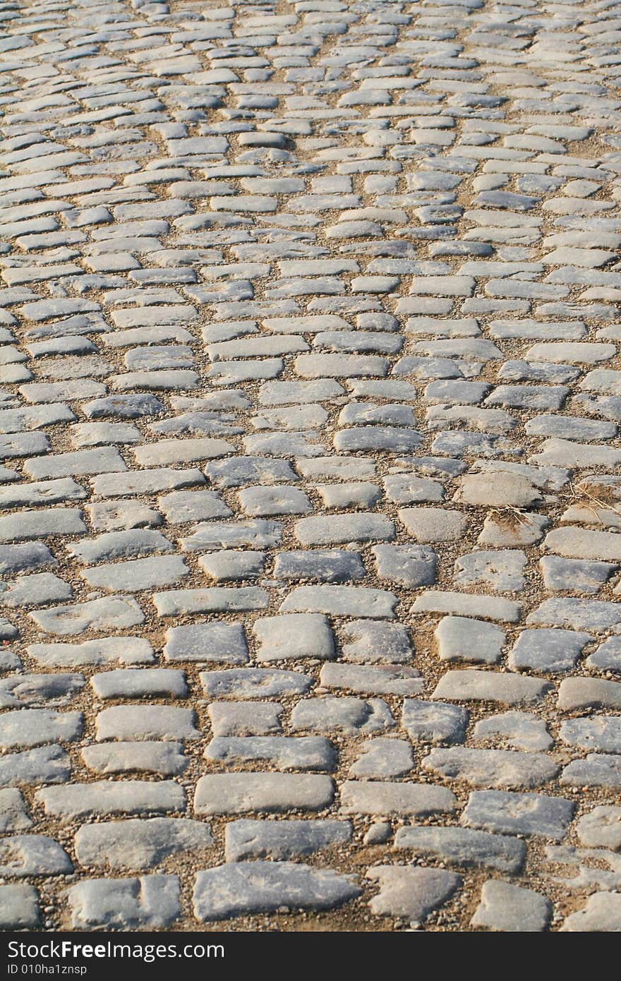 Cobblestone road leading into horizon