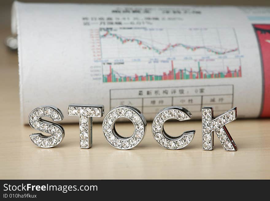 Text of ‘stock’ with newspaper about stock