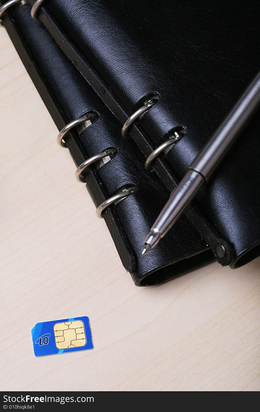 Pocket watch with SIM card on table