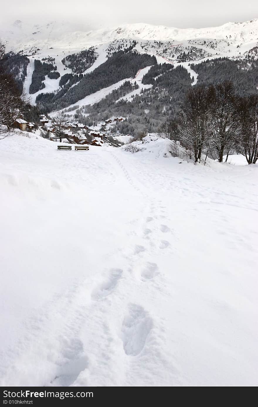 Footprints in the snow leading to the viewpoint at Meribel ski resort, France. Footprints in the snow leading to the viewpoint at Meribel ski resort, France