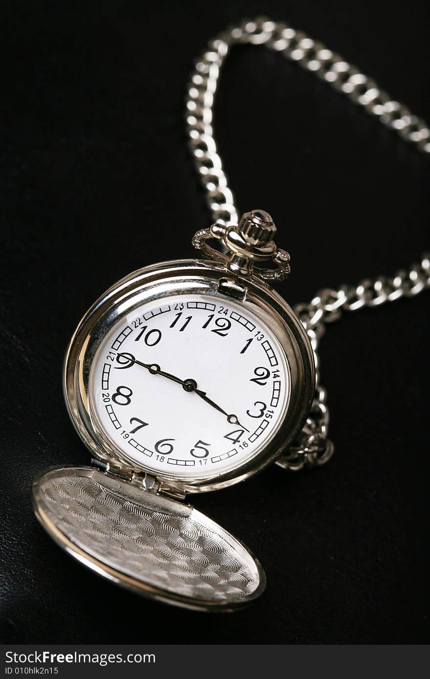 Pocket watch with black background