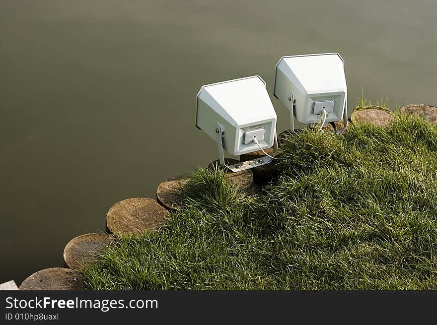 Loud-speake on shore pond