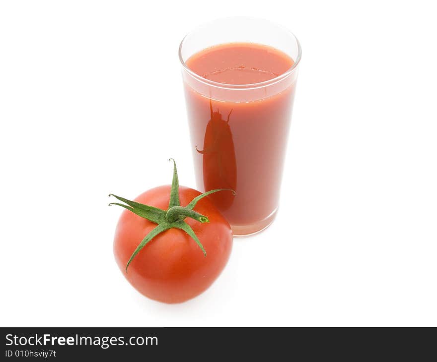 Tomatoes and juice on a white background