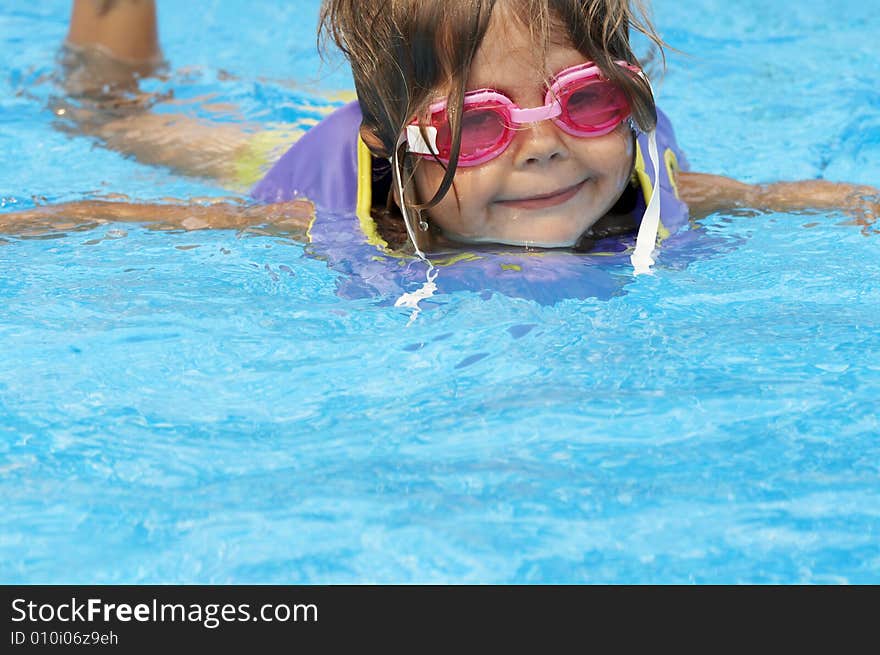 A young girl playing in pool. A young girl playing in pool