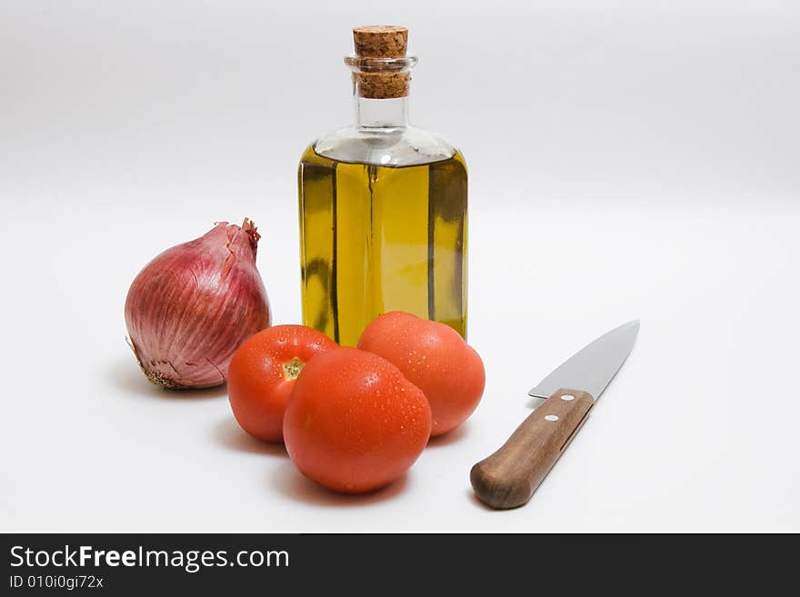 Onion, tomatoes, a bottle of oil - all for salad