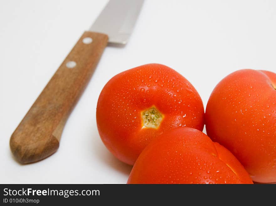 Knife and tomatoes - parts for salad