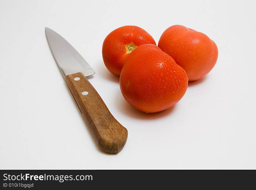 Knife and tomatoes - parts for salad