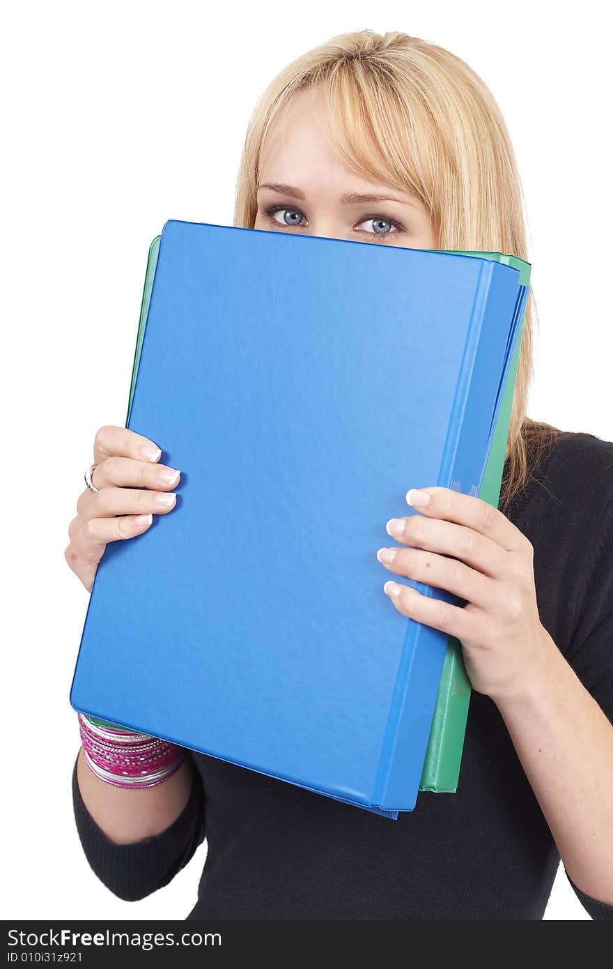 Beautiful blonde businesswoman hiding behind the blue file. Isolated on white background