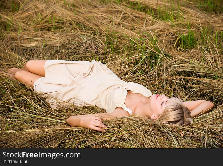 Beautiful girl enjoying the nature on a fresh hay. Beautiful girl enjoying the nature on a fresh hay