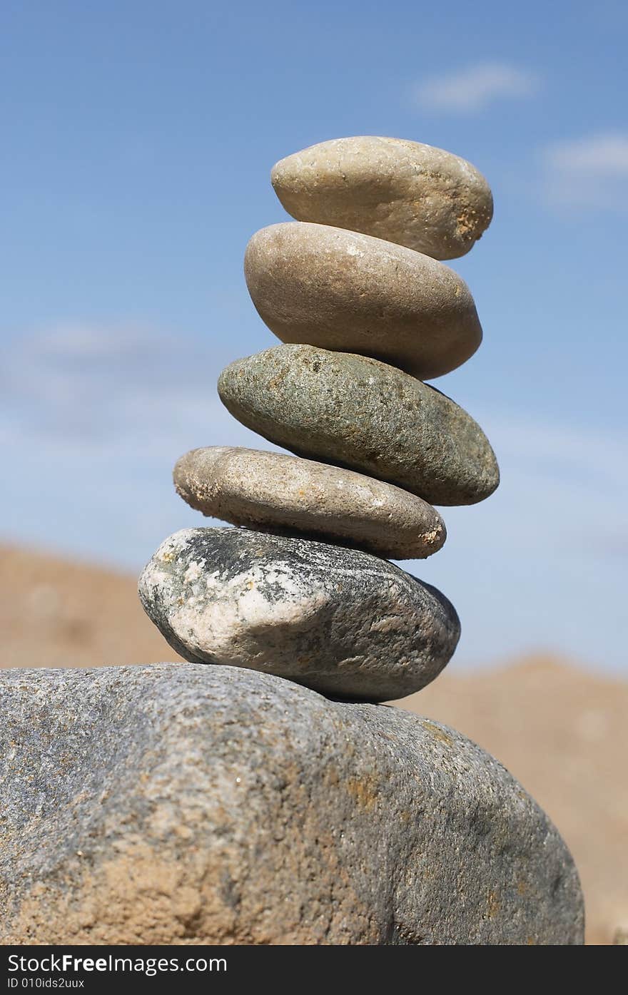 Pyramid of stones , Pebble combined in a pyramid on a background of the sky