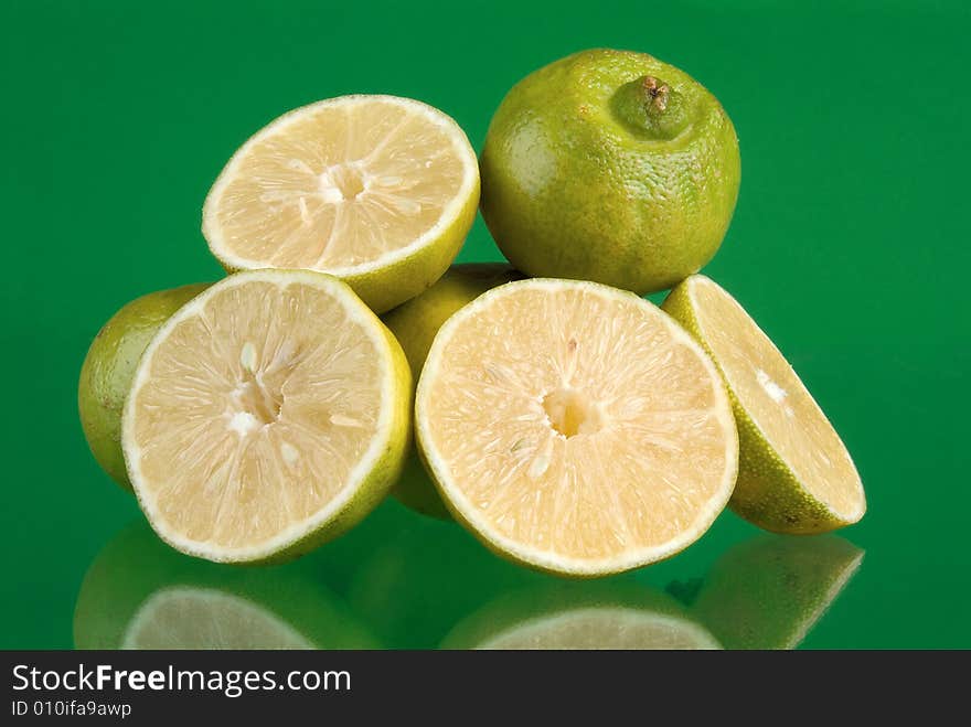 Fresh limes in green background