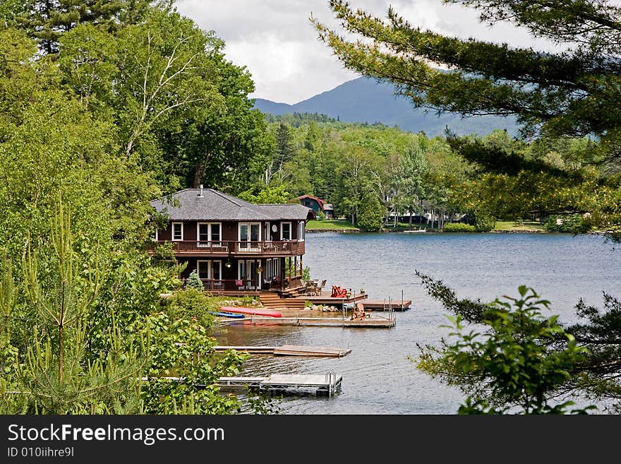 Beautiful house on the water side surrounded by trees. Beautiful house on the water side surrounded by trees