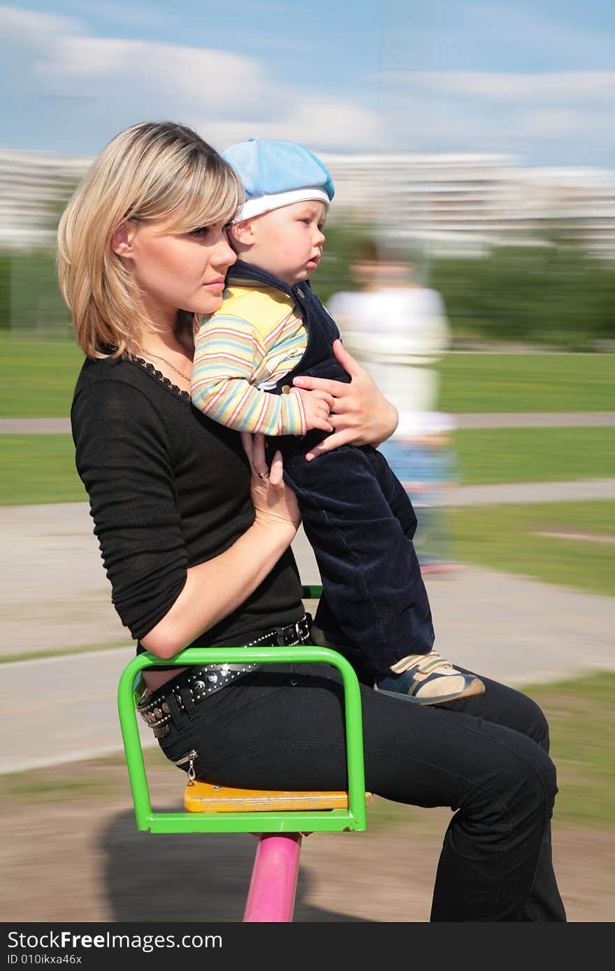 The mother and son on carousel