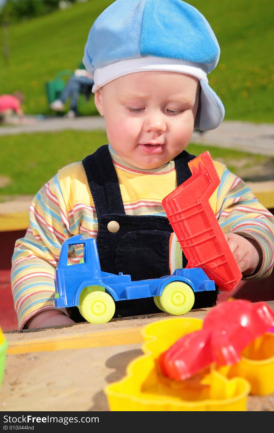 The child and toy car outdoor