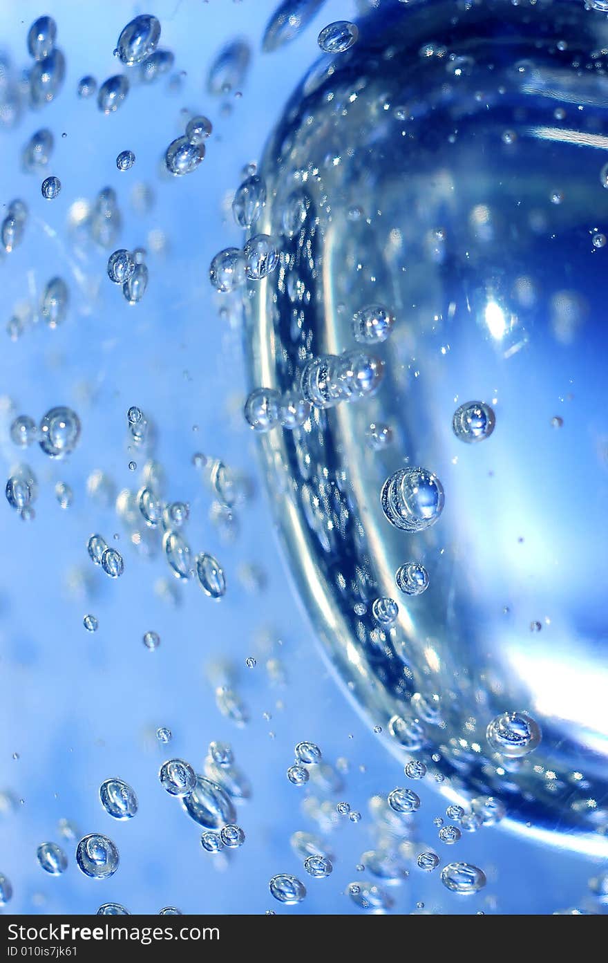 Blue water with bubbles close-up shot