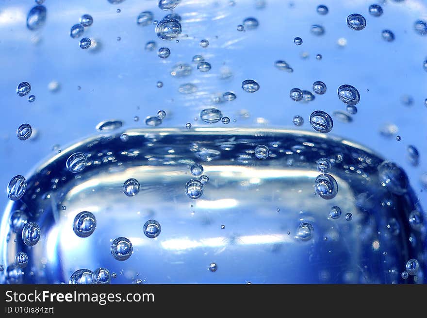 Blue water with bubbles close-up shot