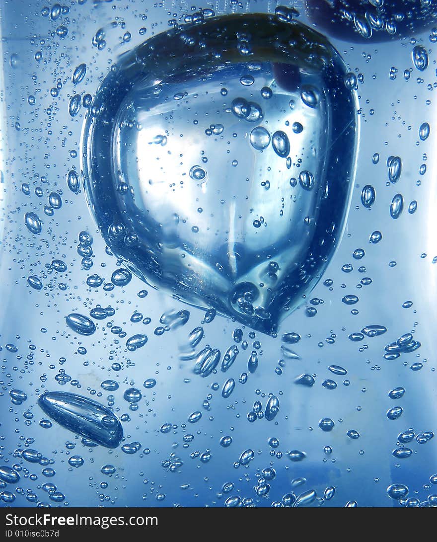 Blue water with bubbles close-up shot