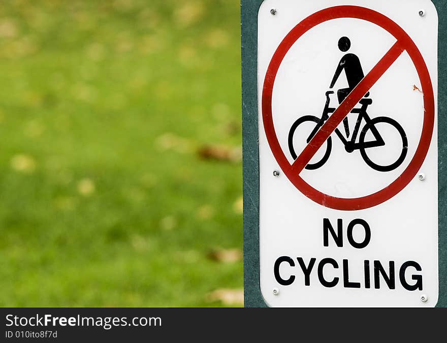 A sign banning the use of bicycles in the park. Photo by Daniel Gregoric. A sign banning the use of bicycles in the park. Photo by Daniel Gregoric