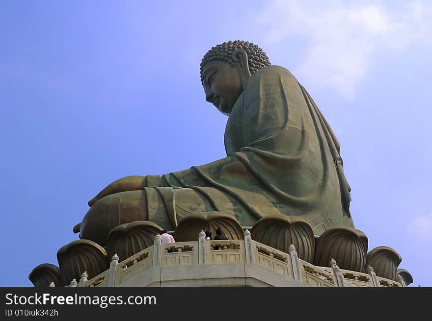 Profile tall budda statue on top of a hill on Lantau Island Hongkong. Profile tall budda statue on top of a hill on Lantau Island Hongkong.