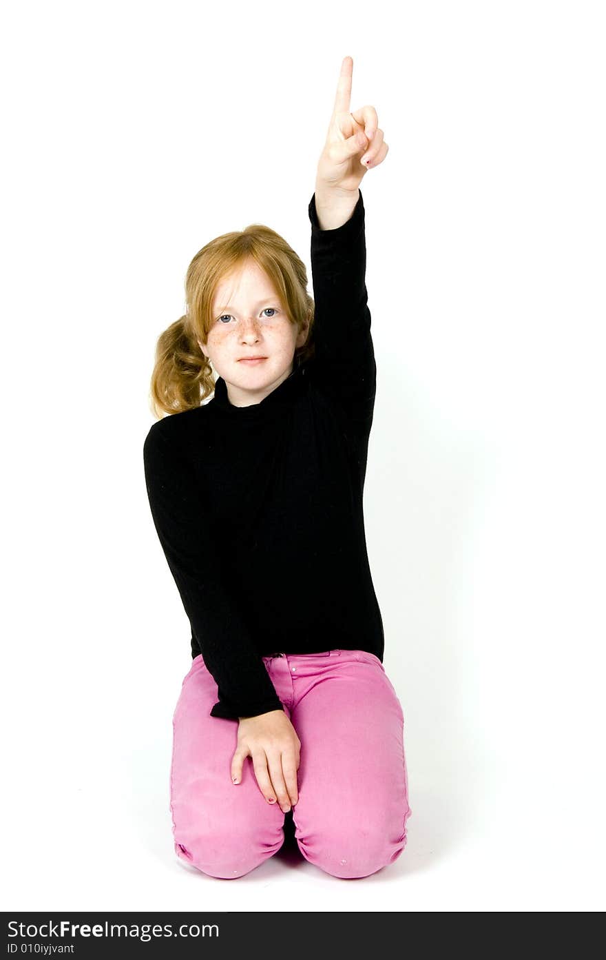 Little girl wants to tell the answer isolated on a white background