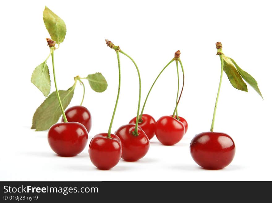 Sweet cherries berry with  green leaves