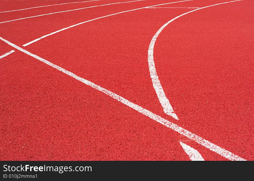 Red tartan athletic track on the stadium