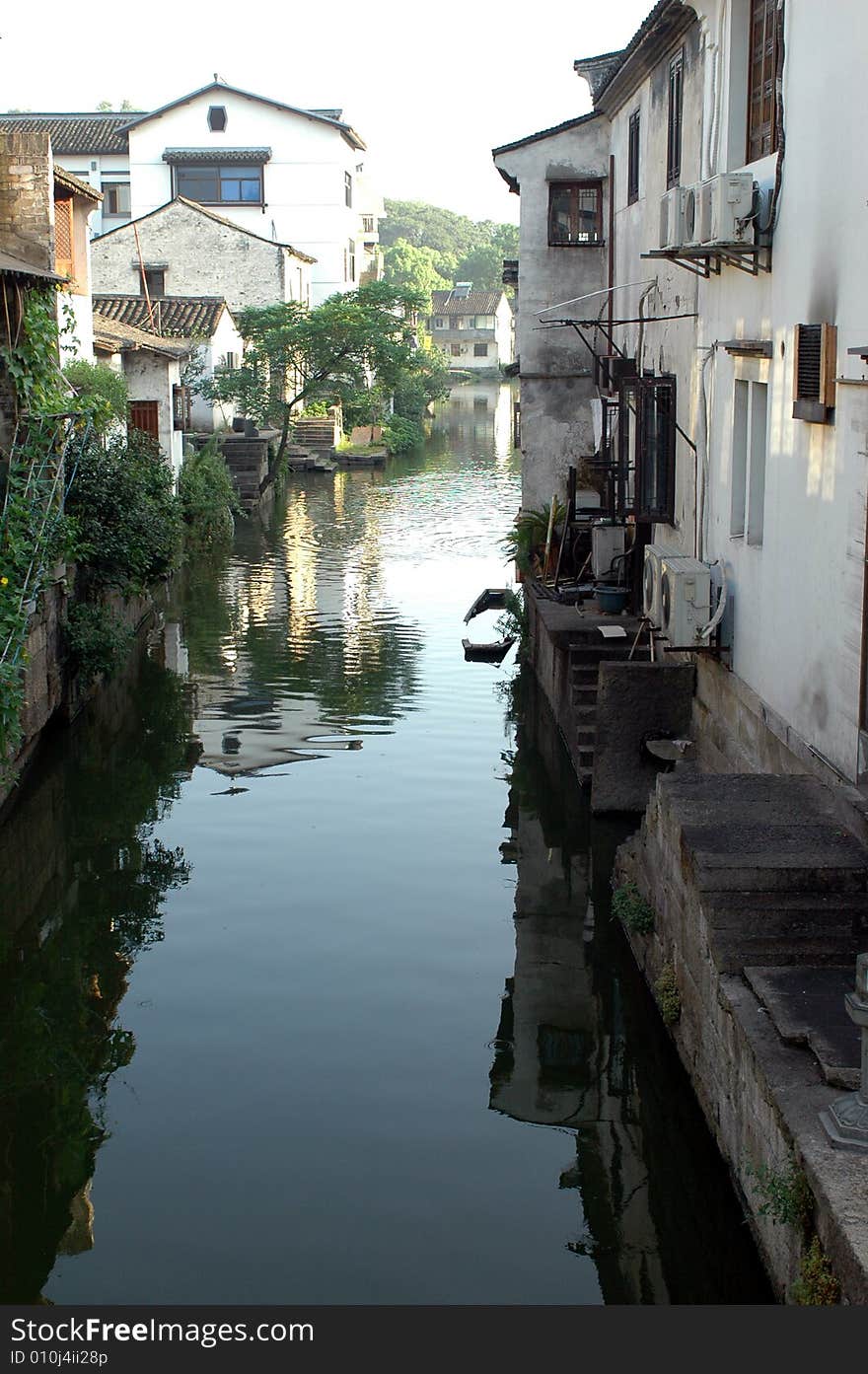 China, Zhejiang province, old town - Shaoxing with historical CanQiao street. Residential area is surrouded by water canals, which were water-roads for transportation in ancient times. Shaoxing is one of few watertowns in Zhejiang province. China, Zhejiang province, old town - Shaoxing with historical CanQiao street. Residential area is surrouded by water canals, which were water-roads for transportation in ancient times. Shaoxing is one of few watertowns in Zhejiang province.