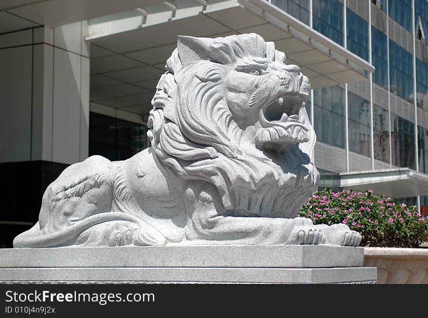 China, lion as guard in front of office's building. China, lion as guard in front of office's building.