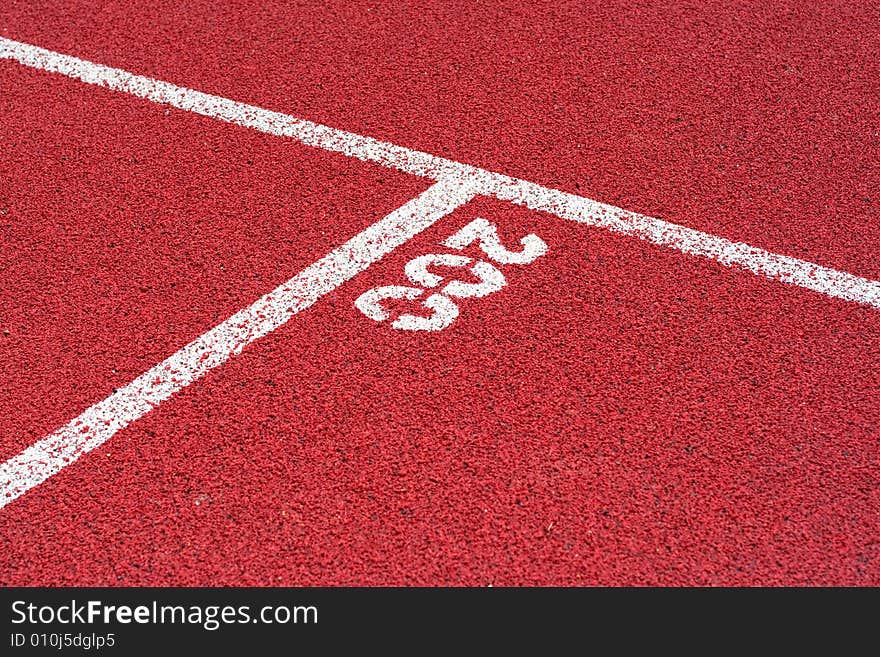 Red tartan athletic track on the stadium