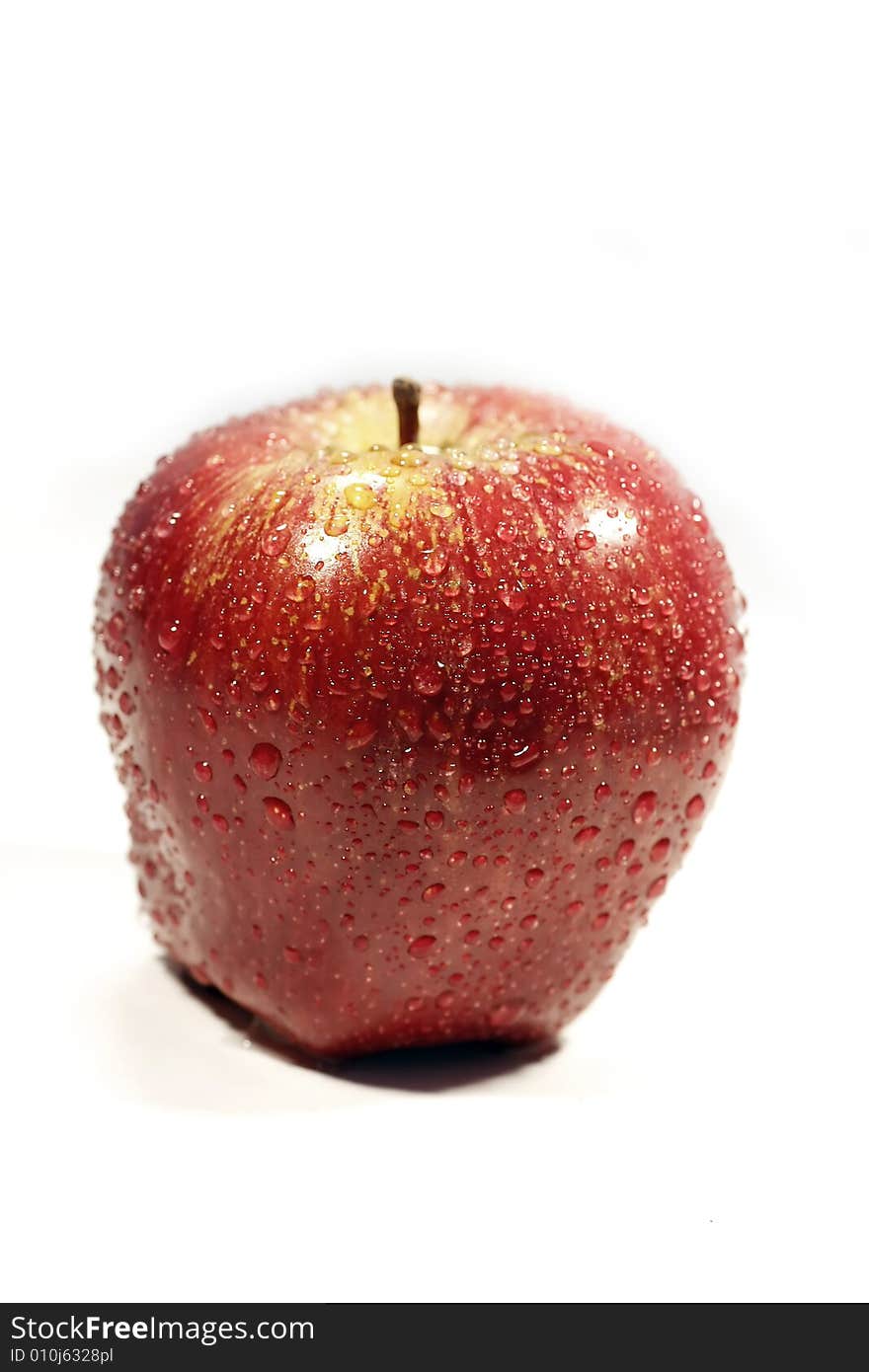 One big juicy and fresh red apple isolated on a white background. One big juicy and fresh red apple isolated on a white background.