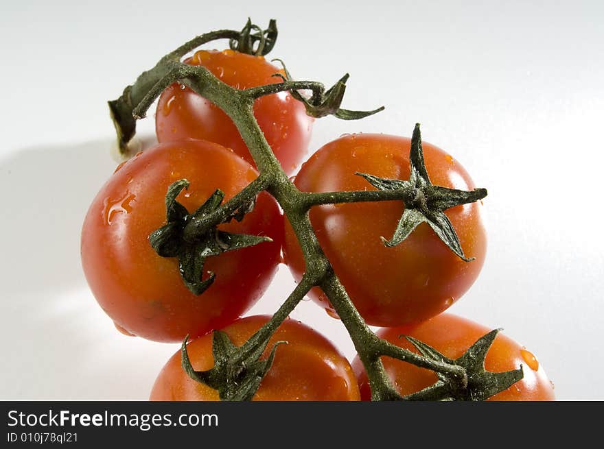 Red tomatoes with water drops