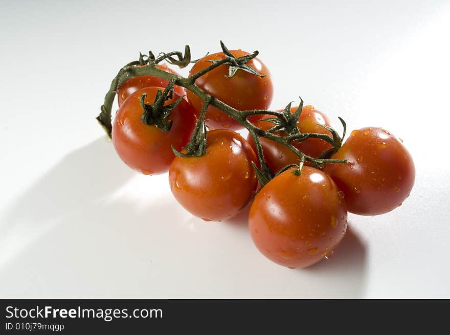 Red tomatoes with water drops