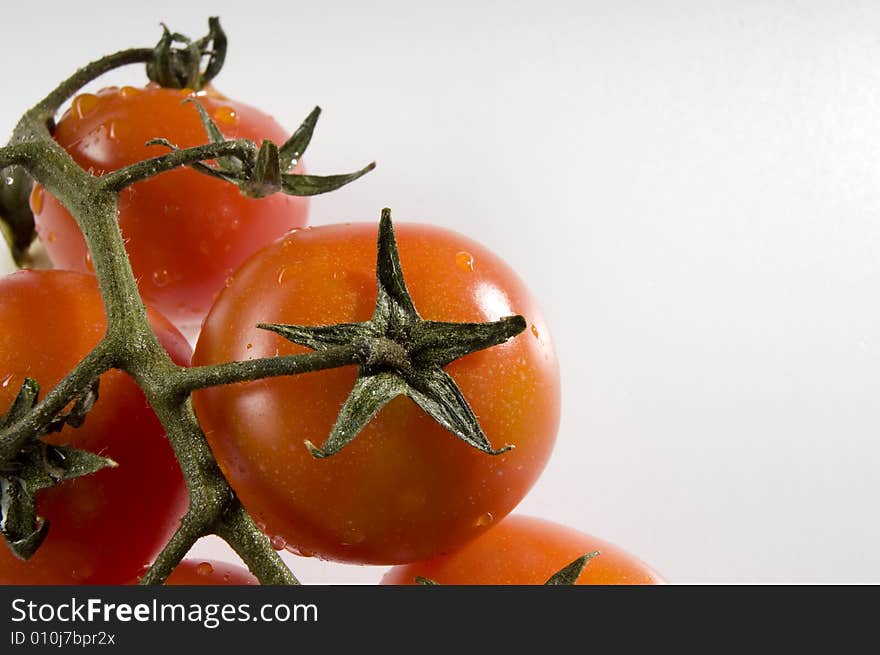 Red tomatoes with water drops