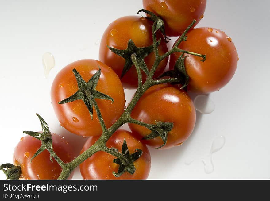 Red tomatoes with water drops