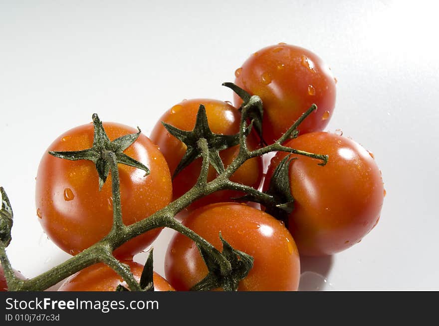 Red tomatoes with water drops