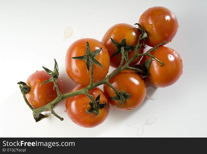 Red tomatoes with water drops