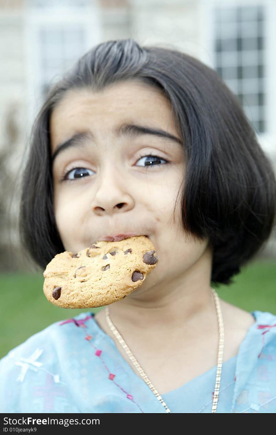 Little girl enjoying cookie