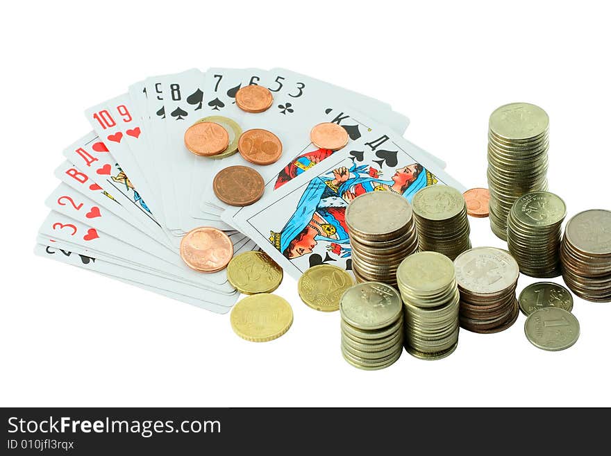 Stack of coins Russian and European cents against the backdrop of playing cards. Stack of coins Russian and European cents against the backdrop of playing cards