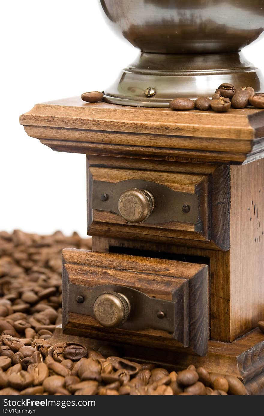 Old fashioned coffee grinder on the white background.