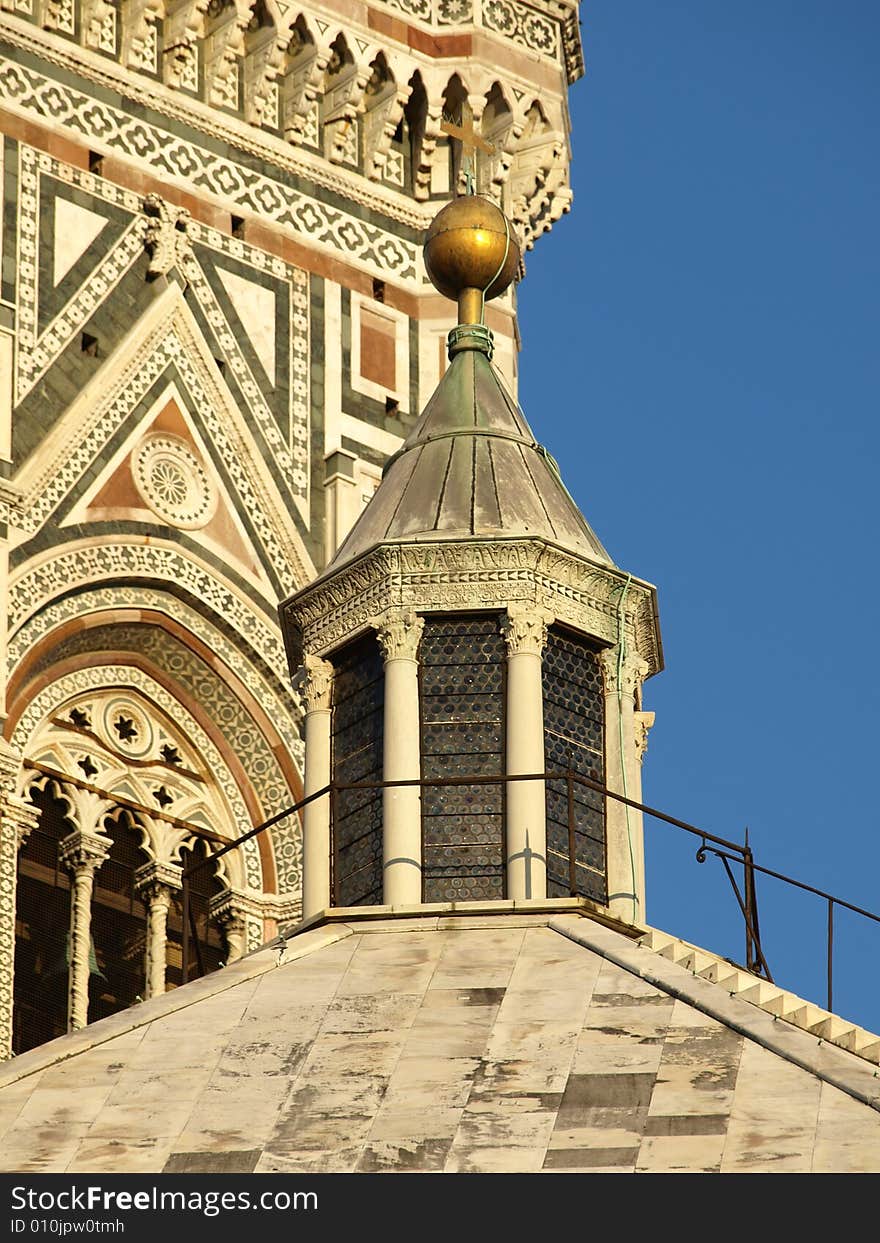 A wonderful shot of the top of the Florence Batipstery with the bell tower background. A wonderful shot of the top of the Florence Batipstery with the bell tower background