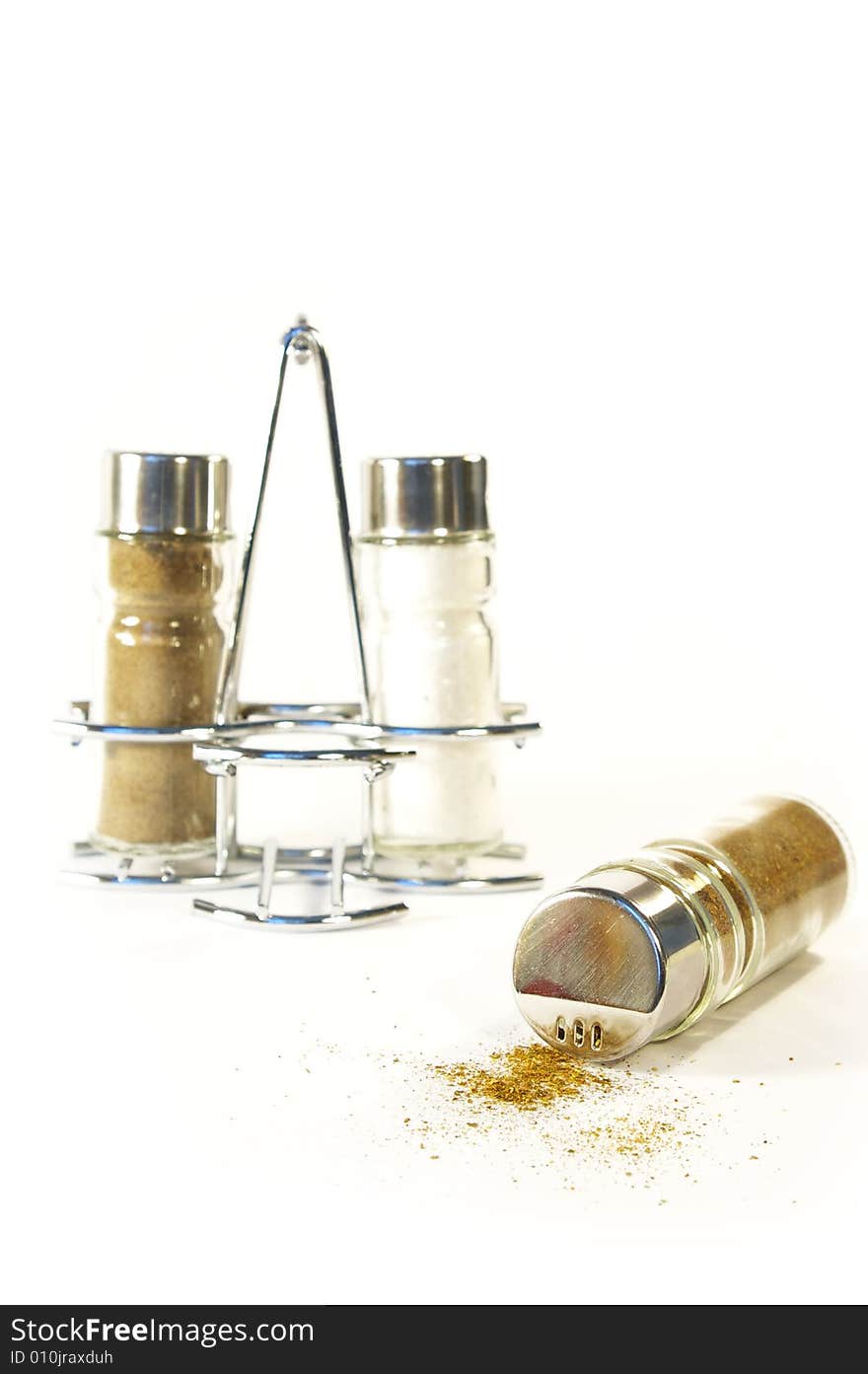 Salt and pepper shakers on a white background. Salt and pepper shakers on a white background.