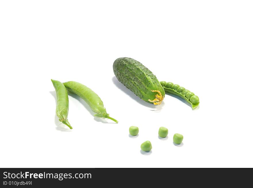 Ripe pea and cucumber isolated on a white background