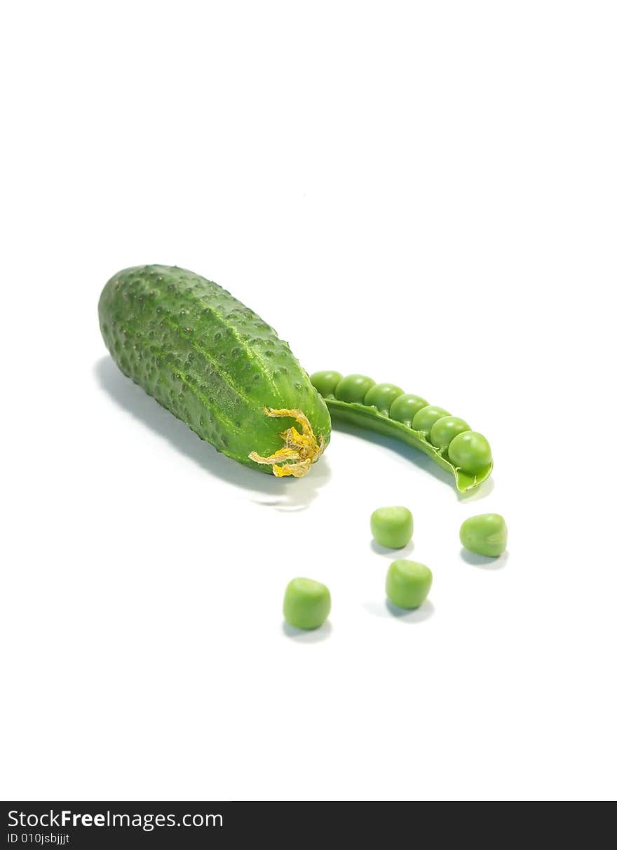 Ripe pea and cucumber isolated on a white background