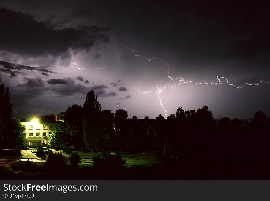 Lightning during night thunderstorm. on city