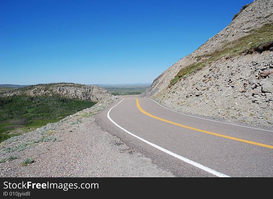 Sandy cliff and winding parkway in glacier national park, Montana, united states. Sandy cliff and winding parkway in glacier national park, Montana, united states