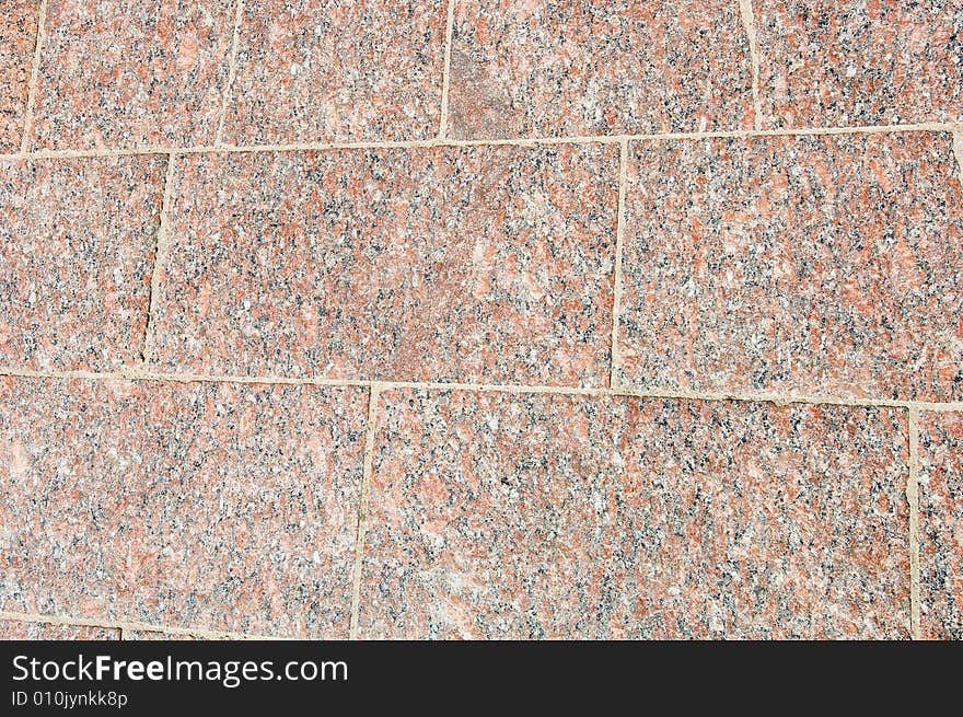 Abstract red granite texture with black details