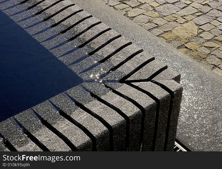 Geometry by fountain with glittering water. Geometry by fountain with glittering water