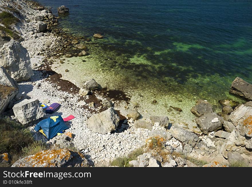 Tents camp on the rocky sea coast. Tents camp on the rocky sea coast